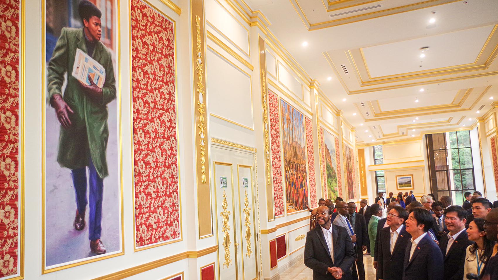 His Majesty King Mswati smiles as he tours the facility with the President of the Republic of China (Taiwan) Lia Ching-te. He shared with the Taiwan President that the portrait on the wall was captured while he was in London.